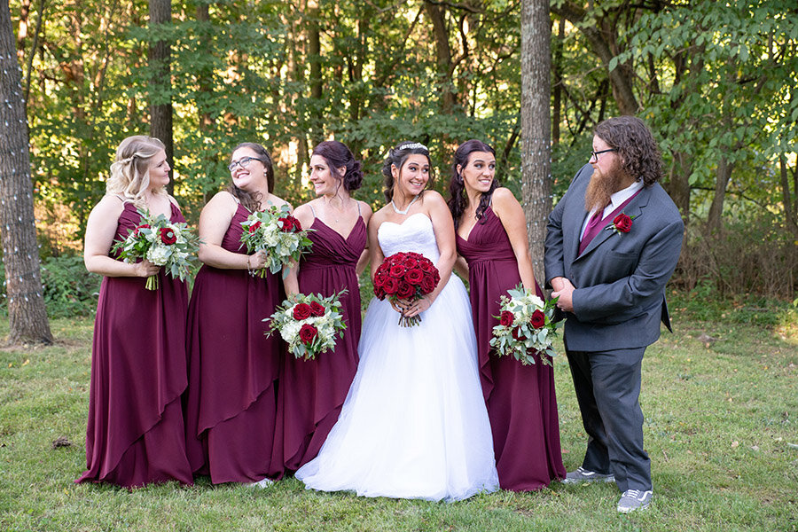 Bride with her bridesmaids and groomsman