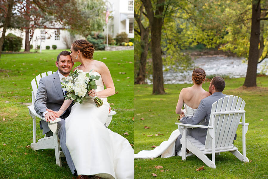 Bride &amp; Groom seated in Adirondack Chairs looking at the Conestoga River