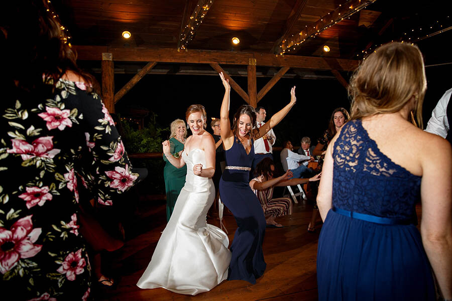 Bride dancing with Bridesmaid at Riverdale Manor