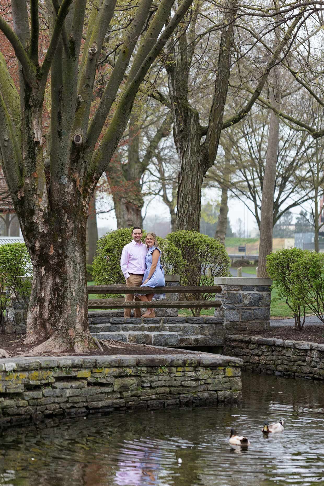 Couple sitting on a bridge at Lititz Springs Park, Lititz, PA