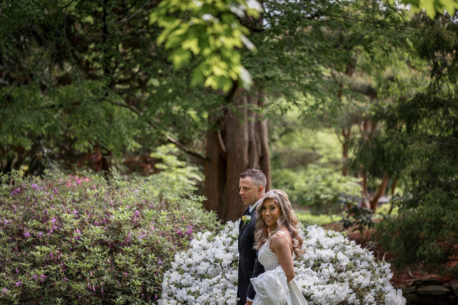 Bride and groom walking in Hershey Gardens