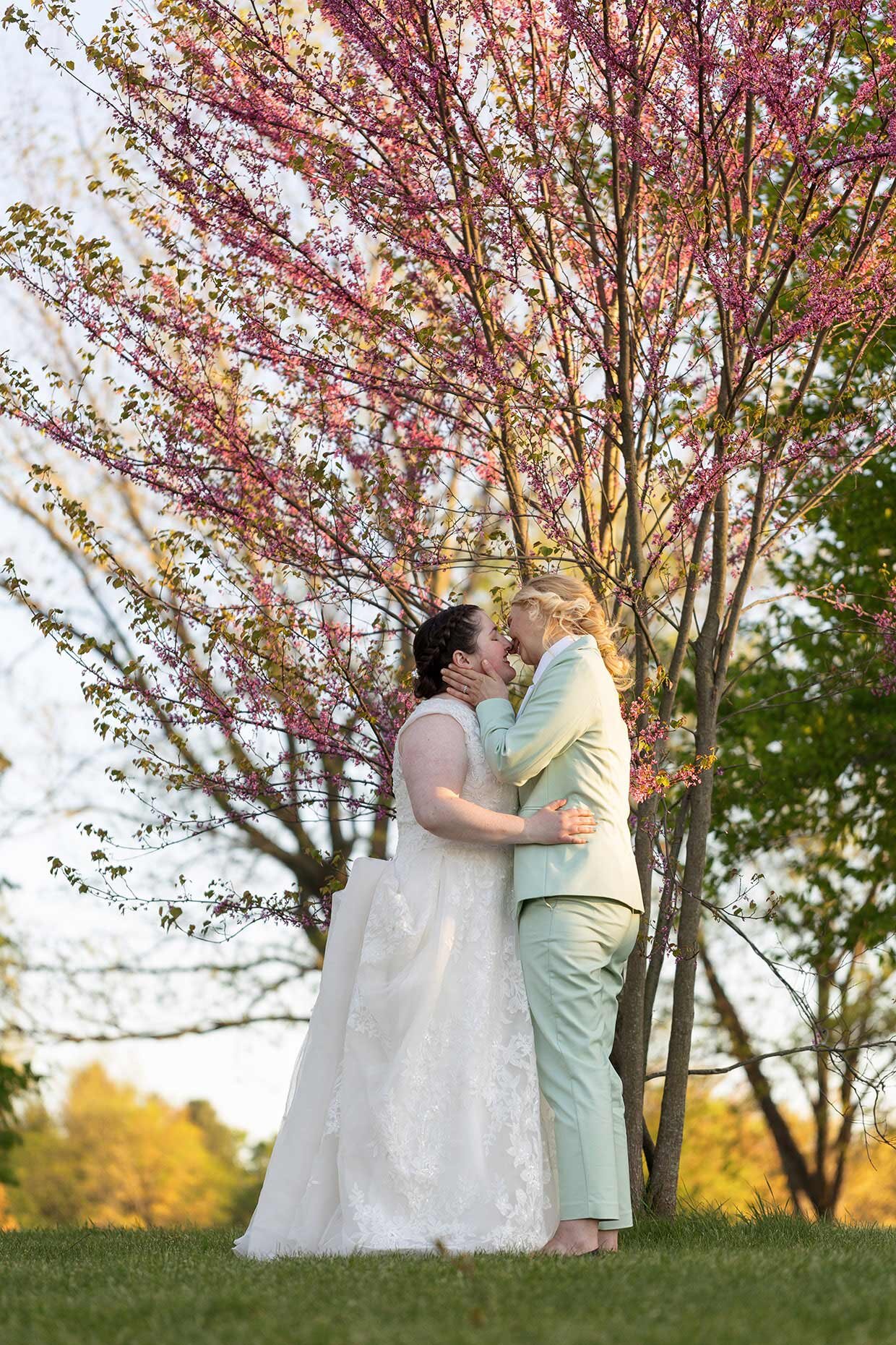 Pink blooms for first kiss as wives