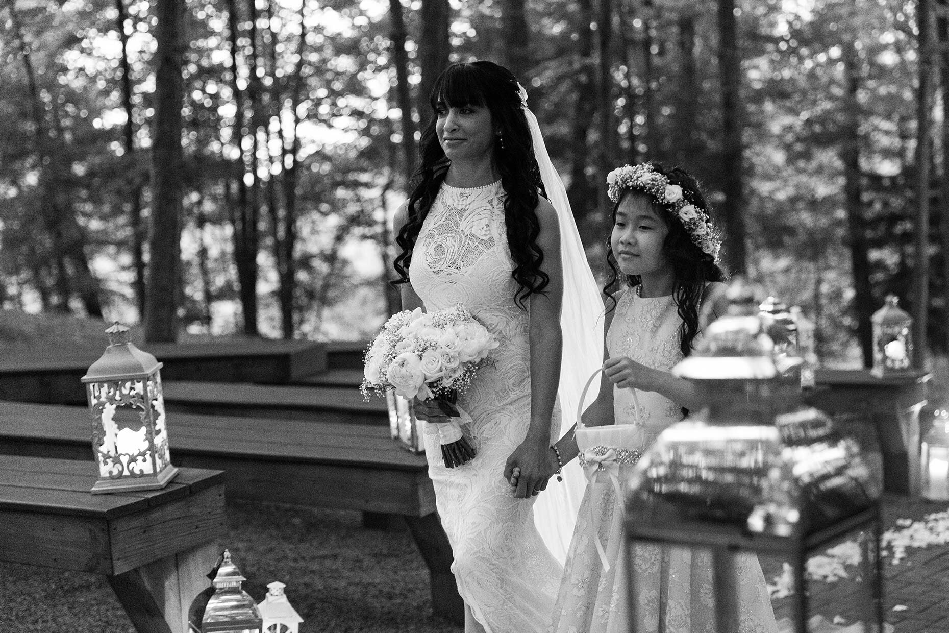 Flower girl and bride walking hand in hand