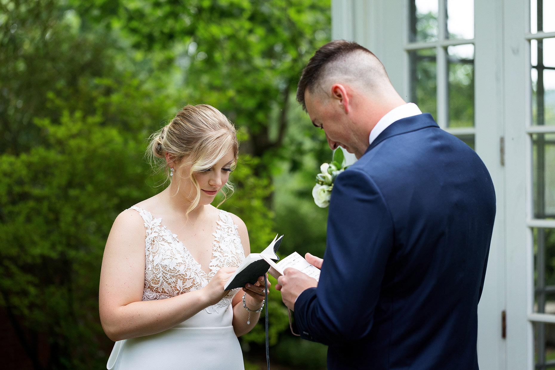 Bride &amp; Groom Reading Vows at Lily Manor Wedding Central Mifflin, PA 