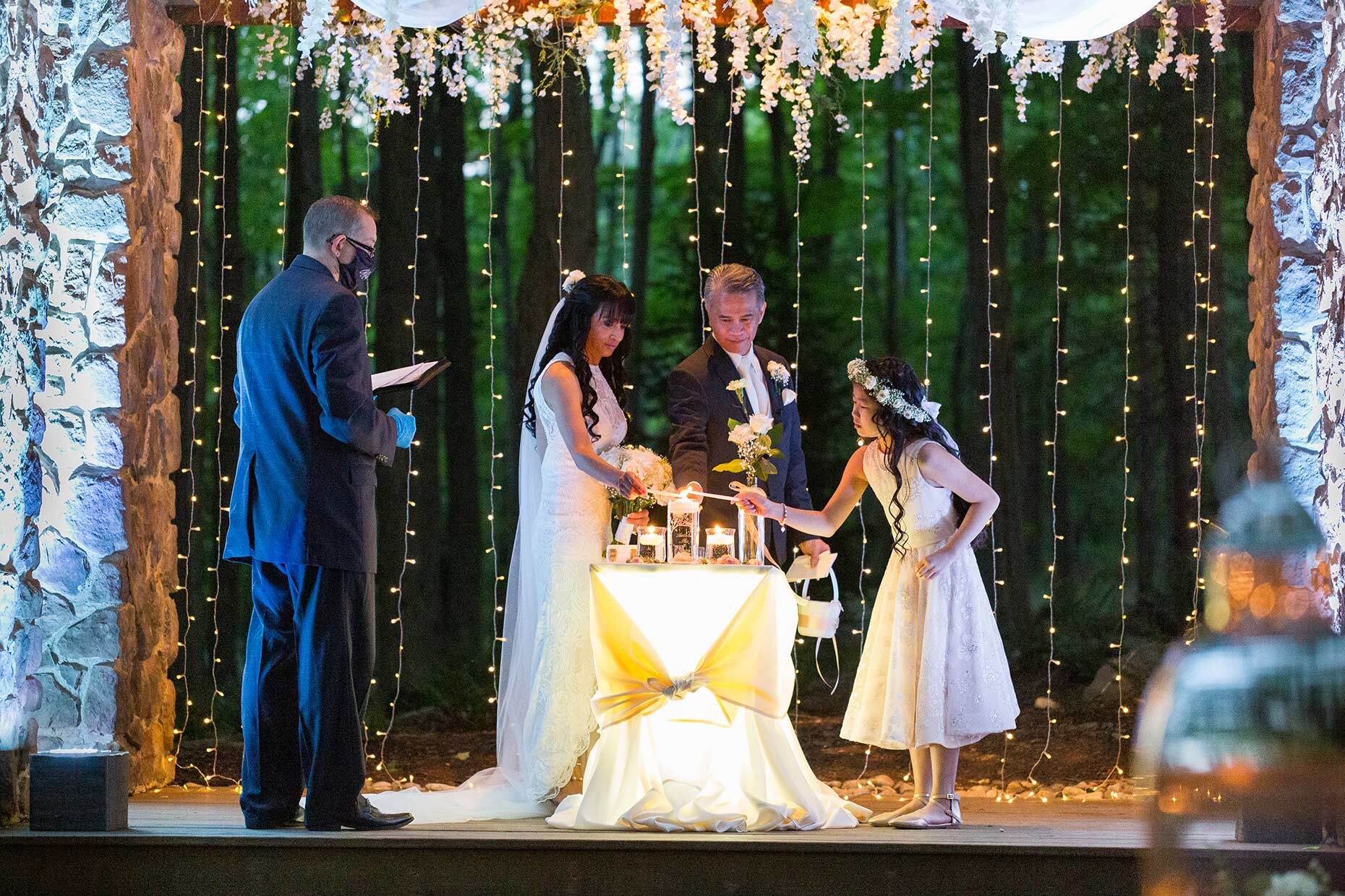 Family Lighting Unity candle at vow renewal