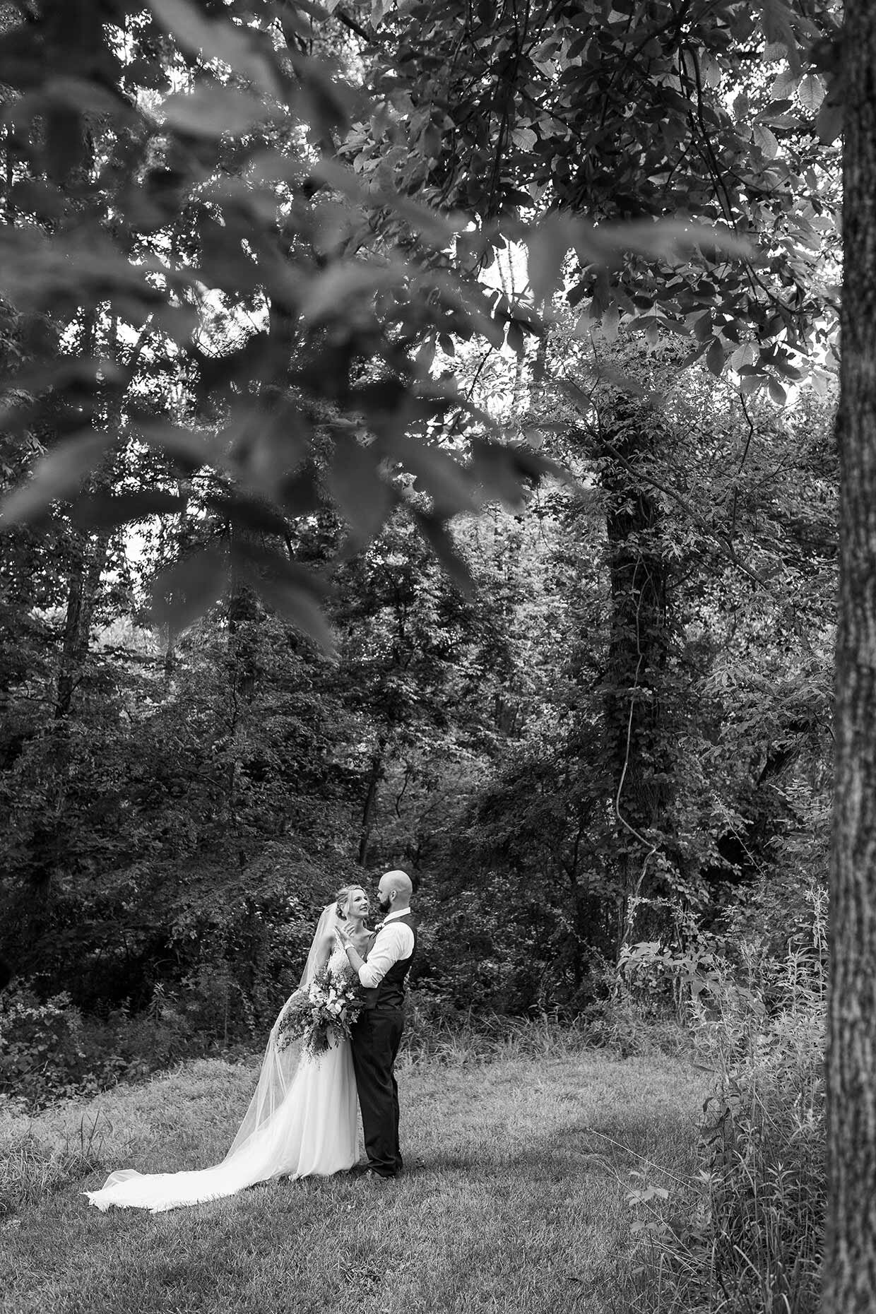 Bride and Groom in a forest in black and white 