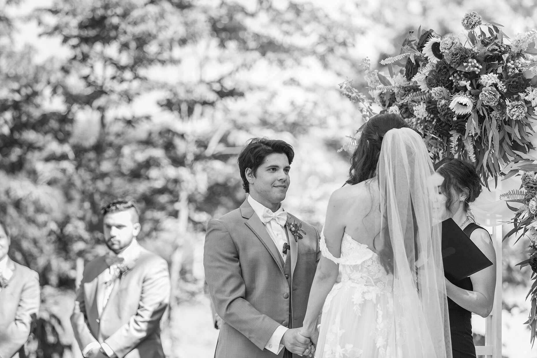 Groom’s reaction in black and white