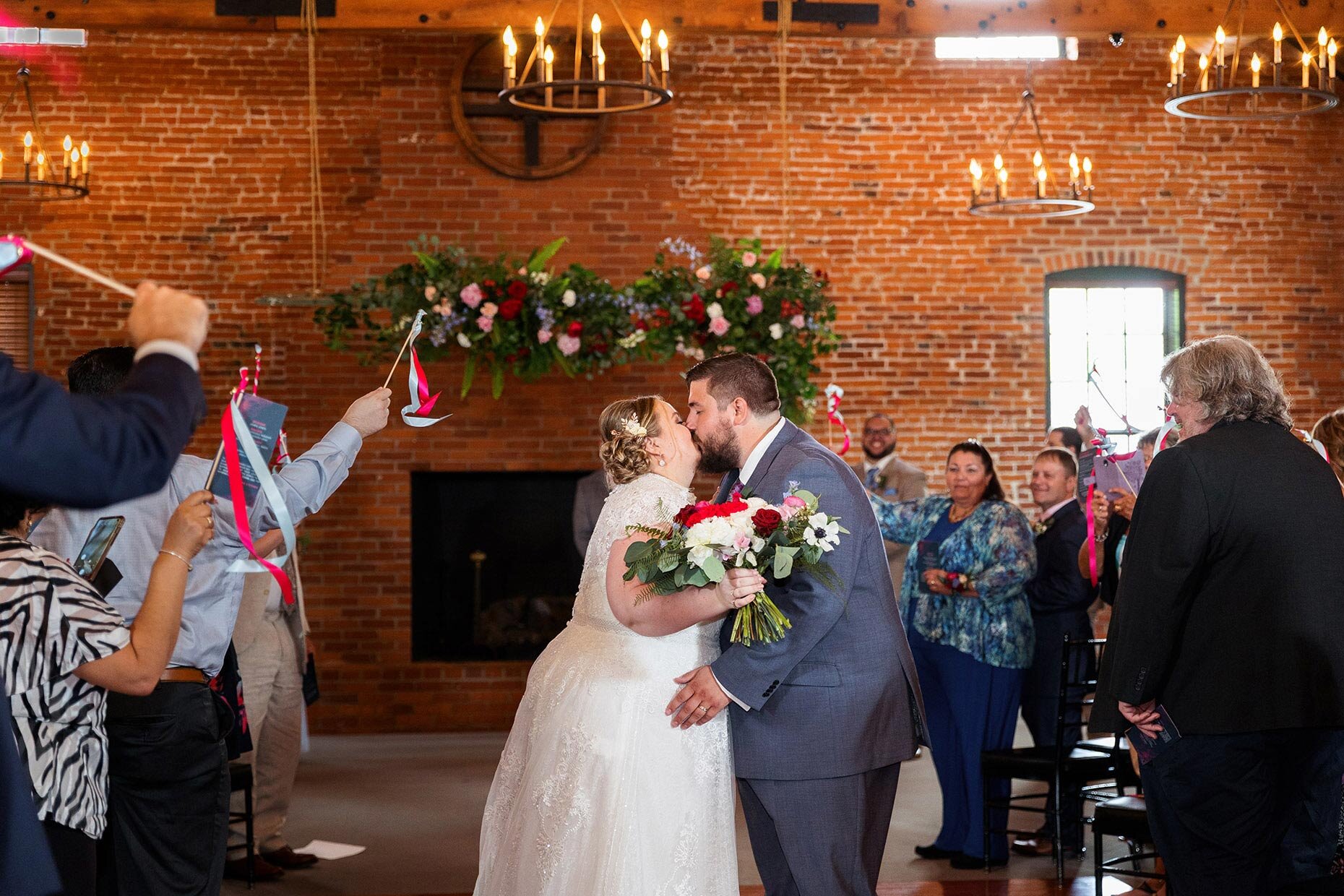 Recessional kiss with ribbons