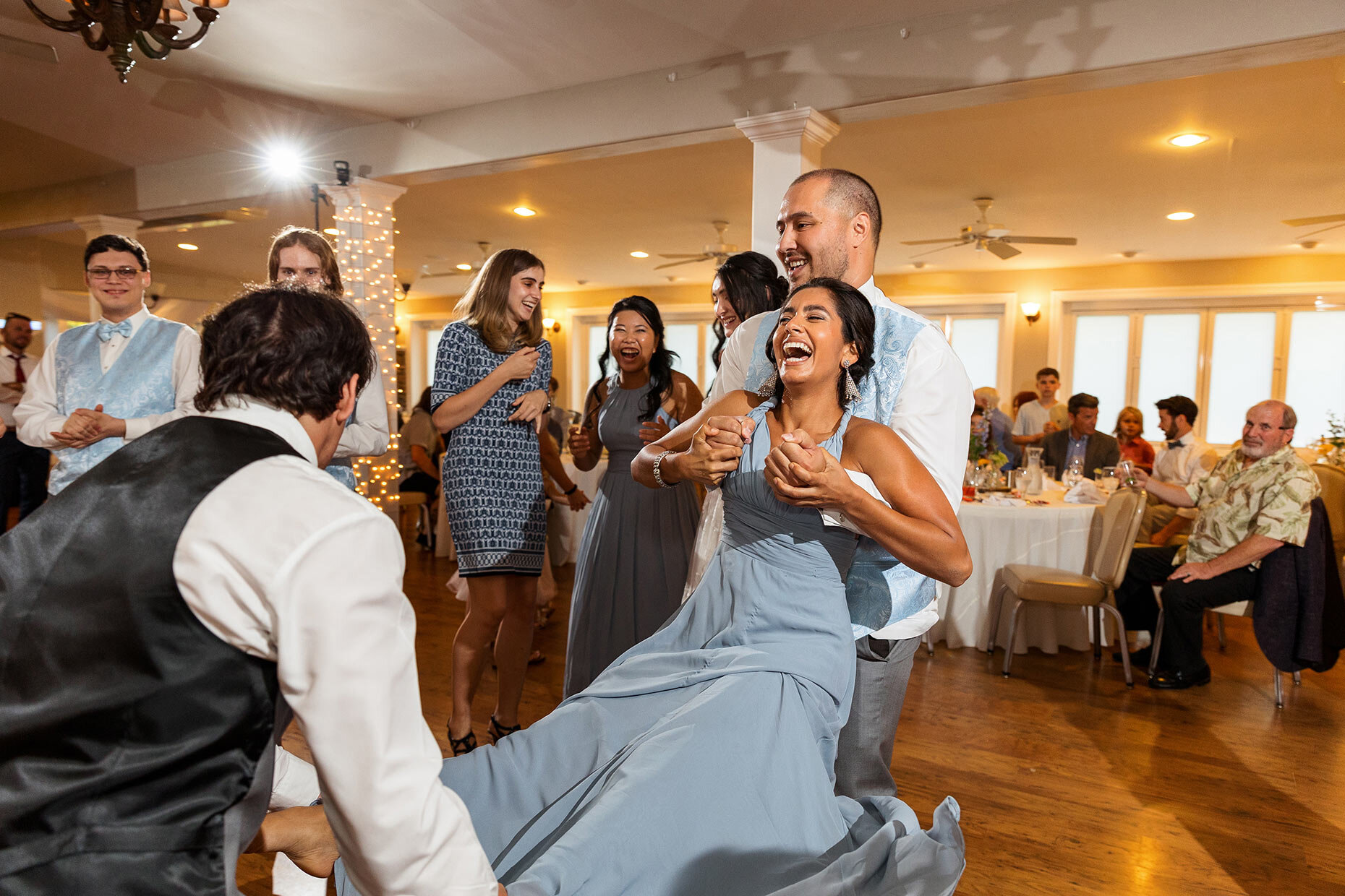 Bridesmaid swings during reception