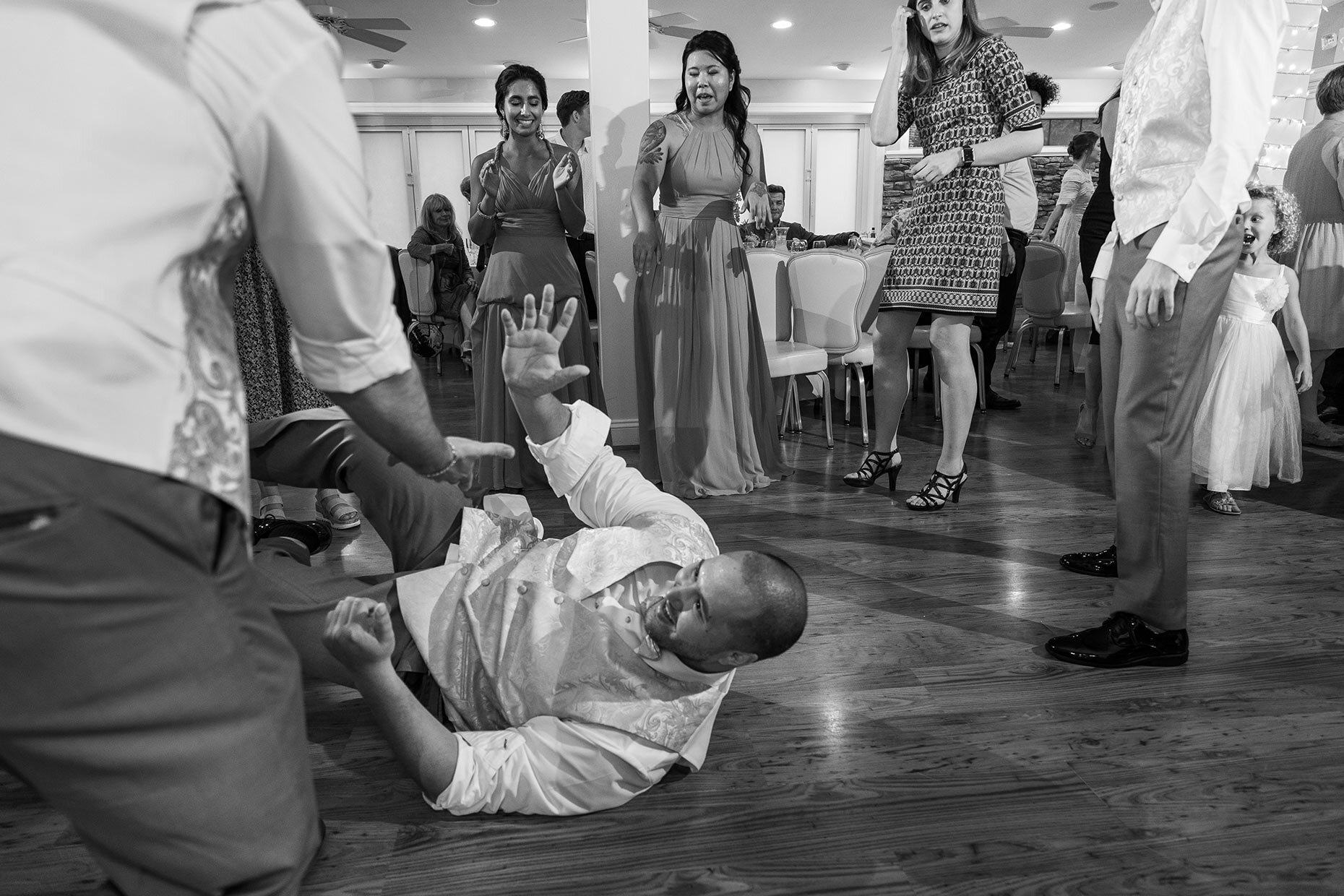 Groomsmen break dancing at reception