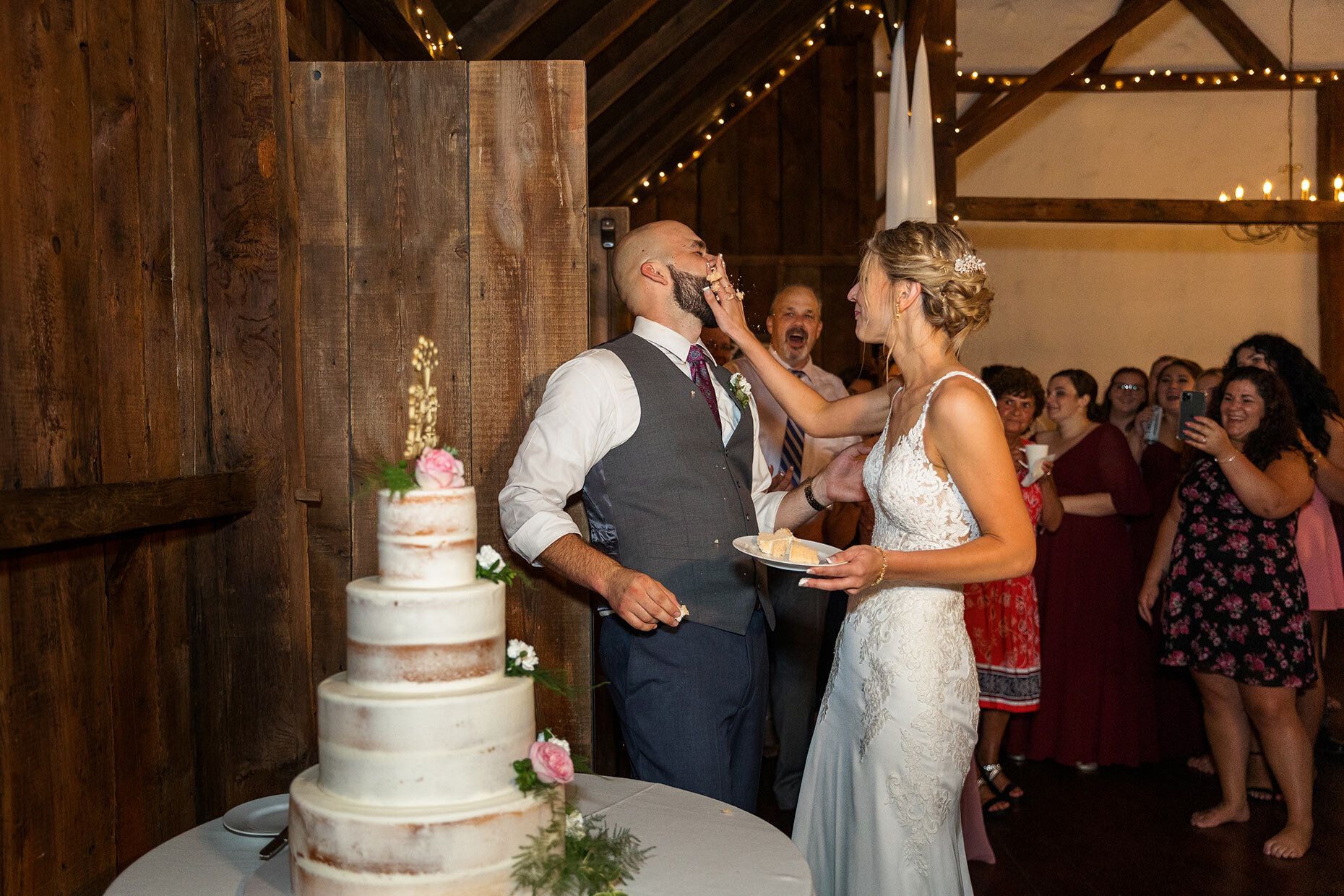 Bride smashes cake in groom's face