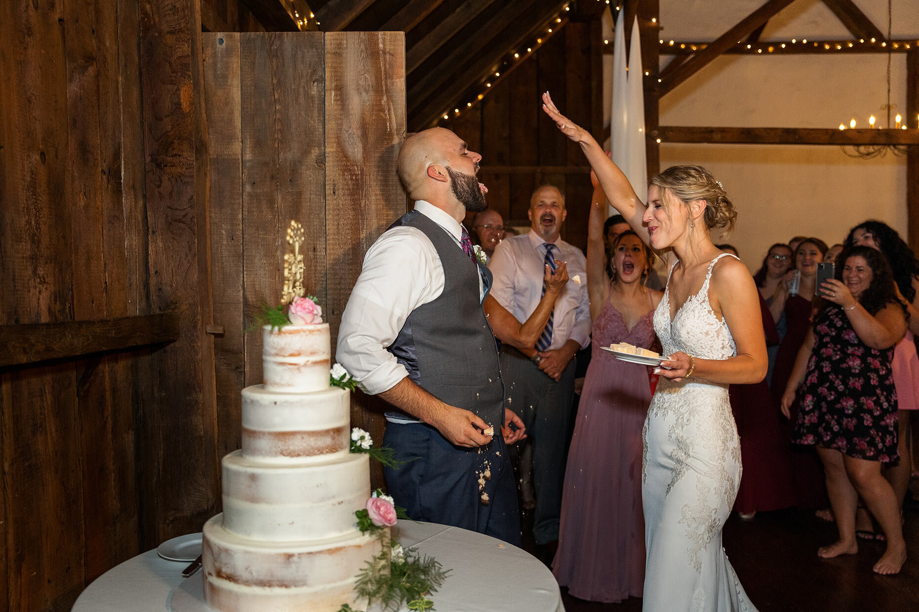 Bride smashes cake in groom's face