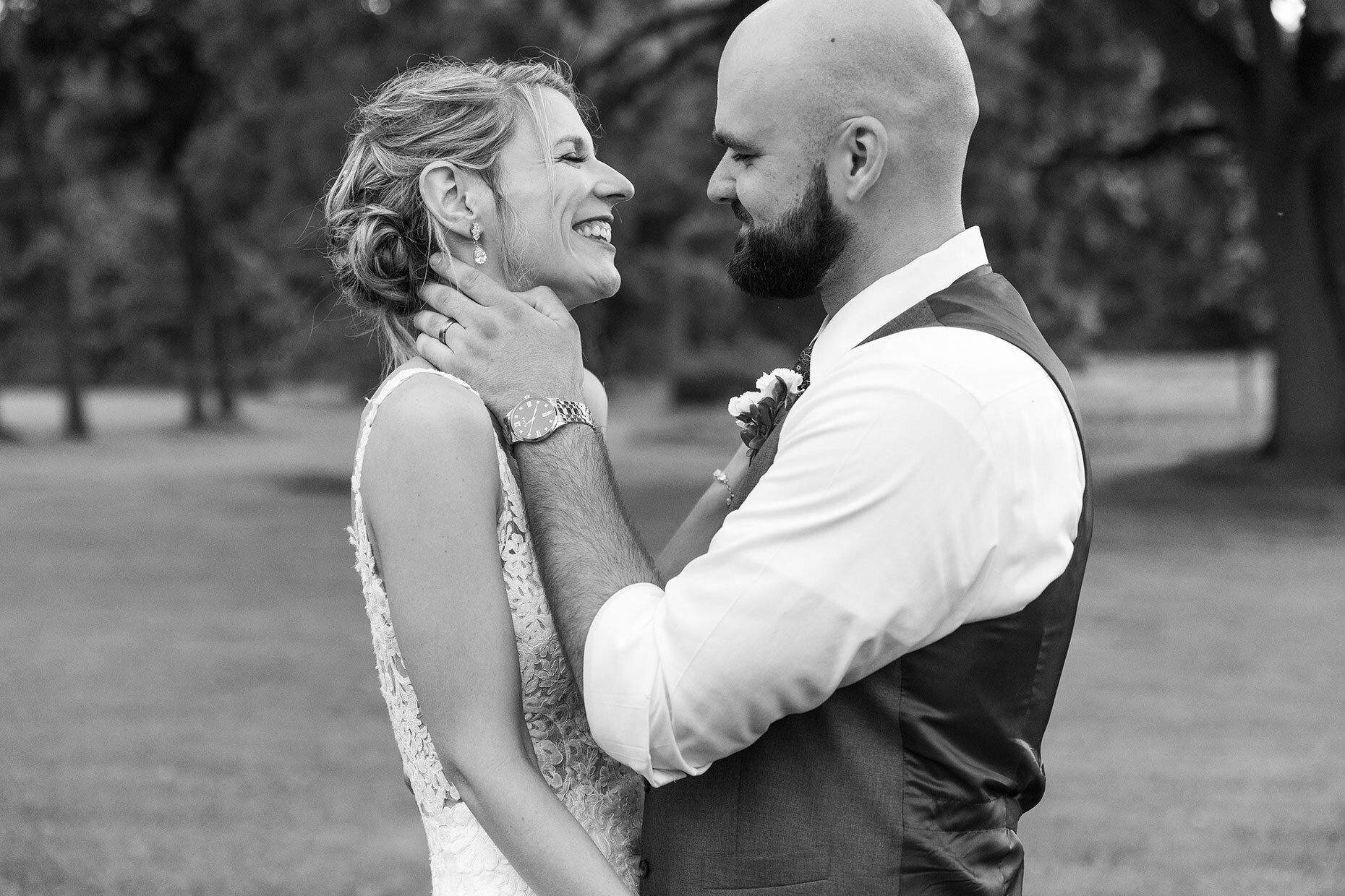 Black and white candid of bride and groom 