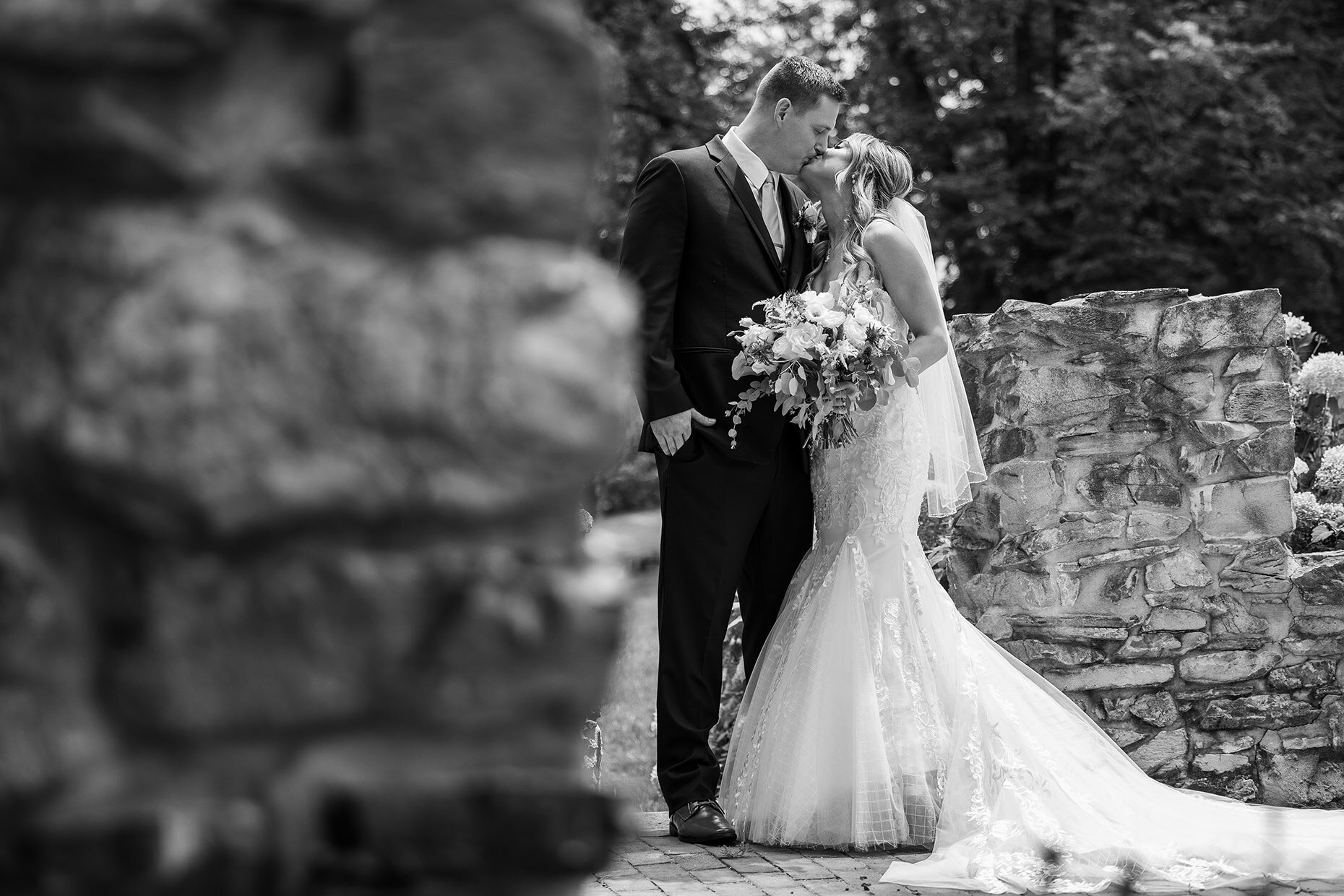 Bride and Groom kissing in black and white