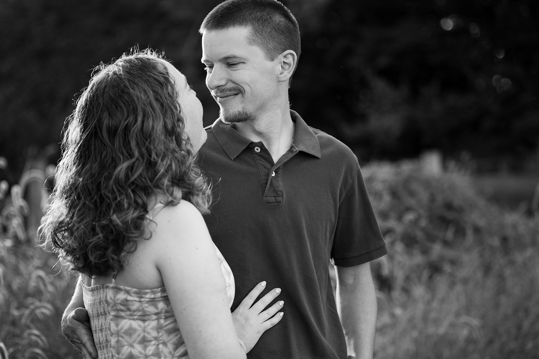 Black and white engagement photos looking 