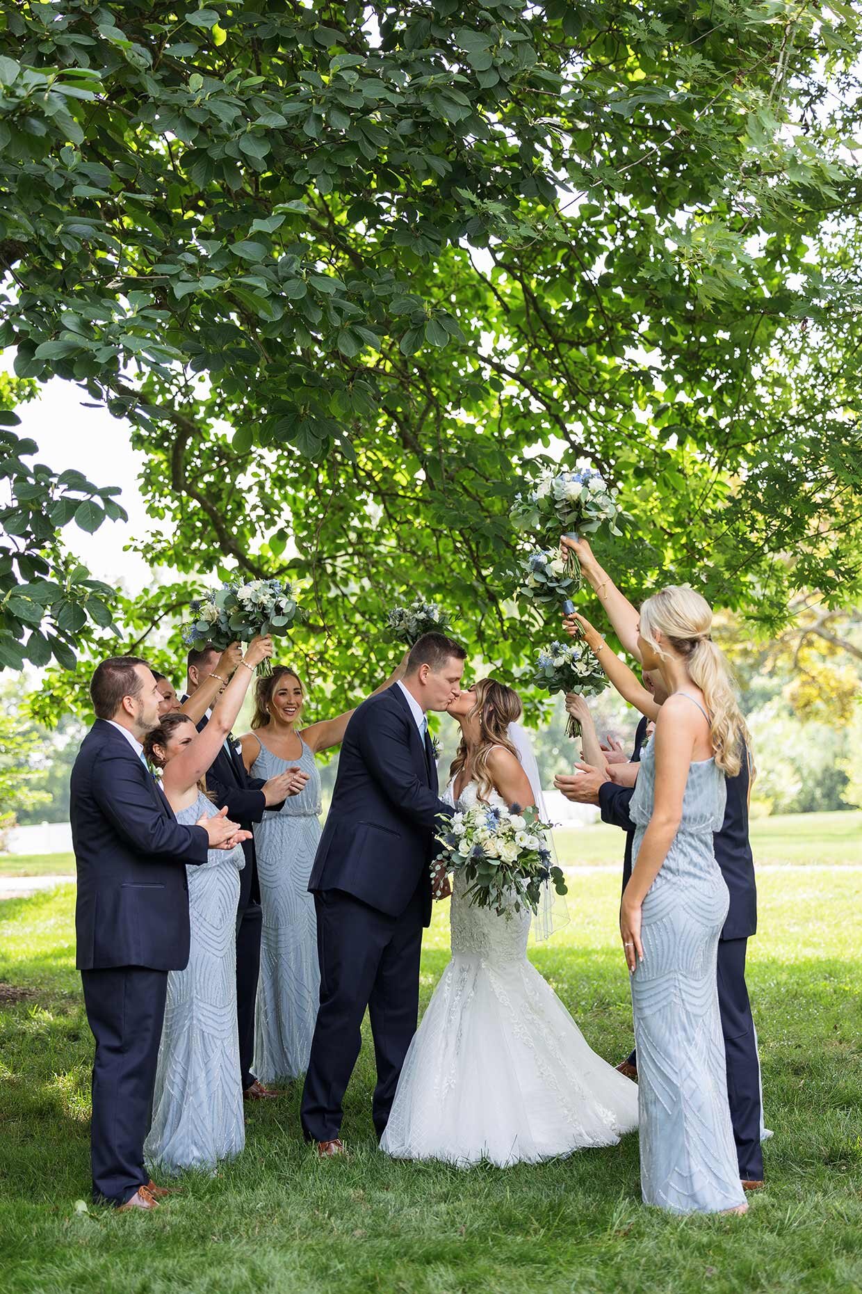 Bridal party celebrating bride and groom