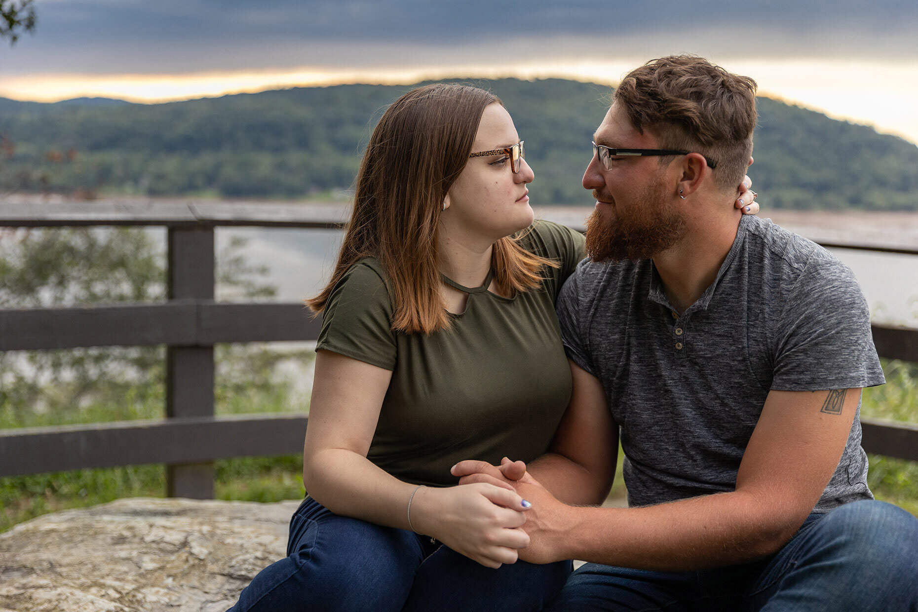 Couple sitting along susquehanna river