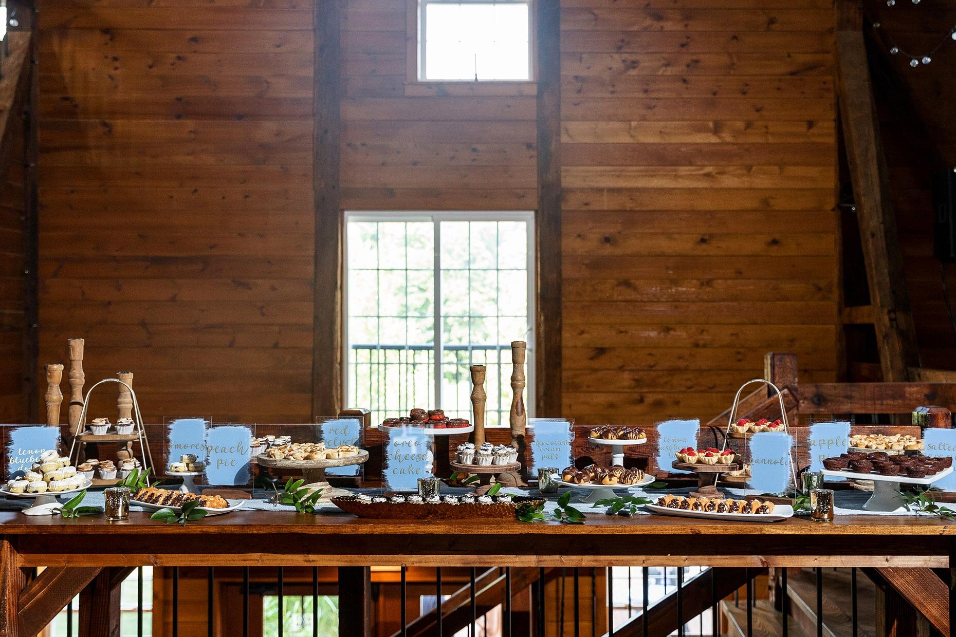 Dessert table with dusty blue signs