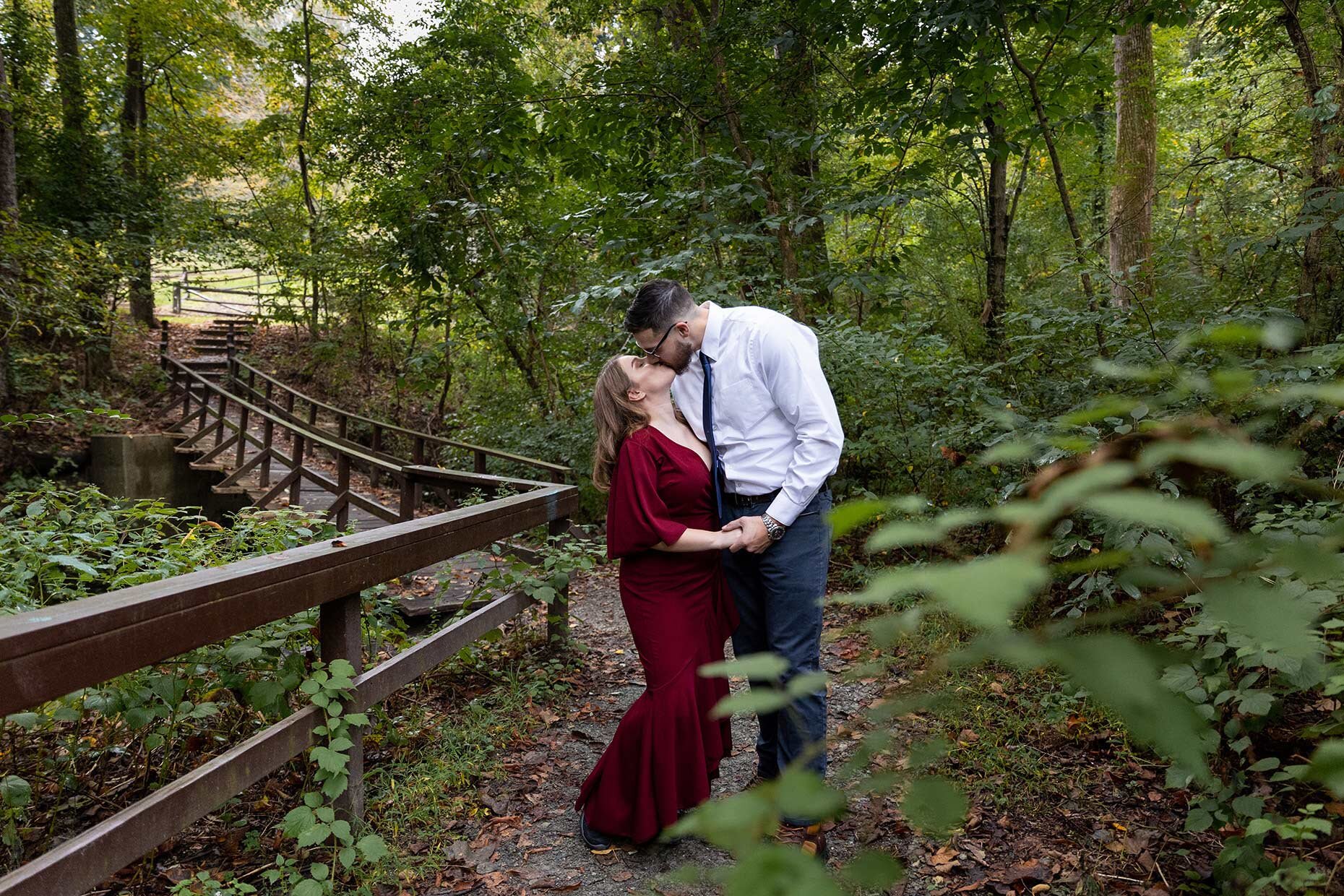 Engagement photos in the woods kissing