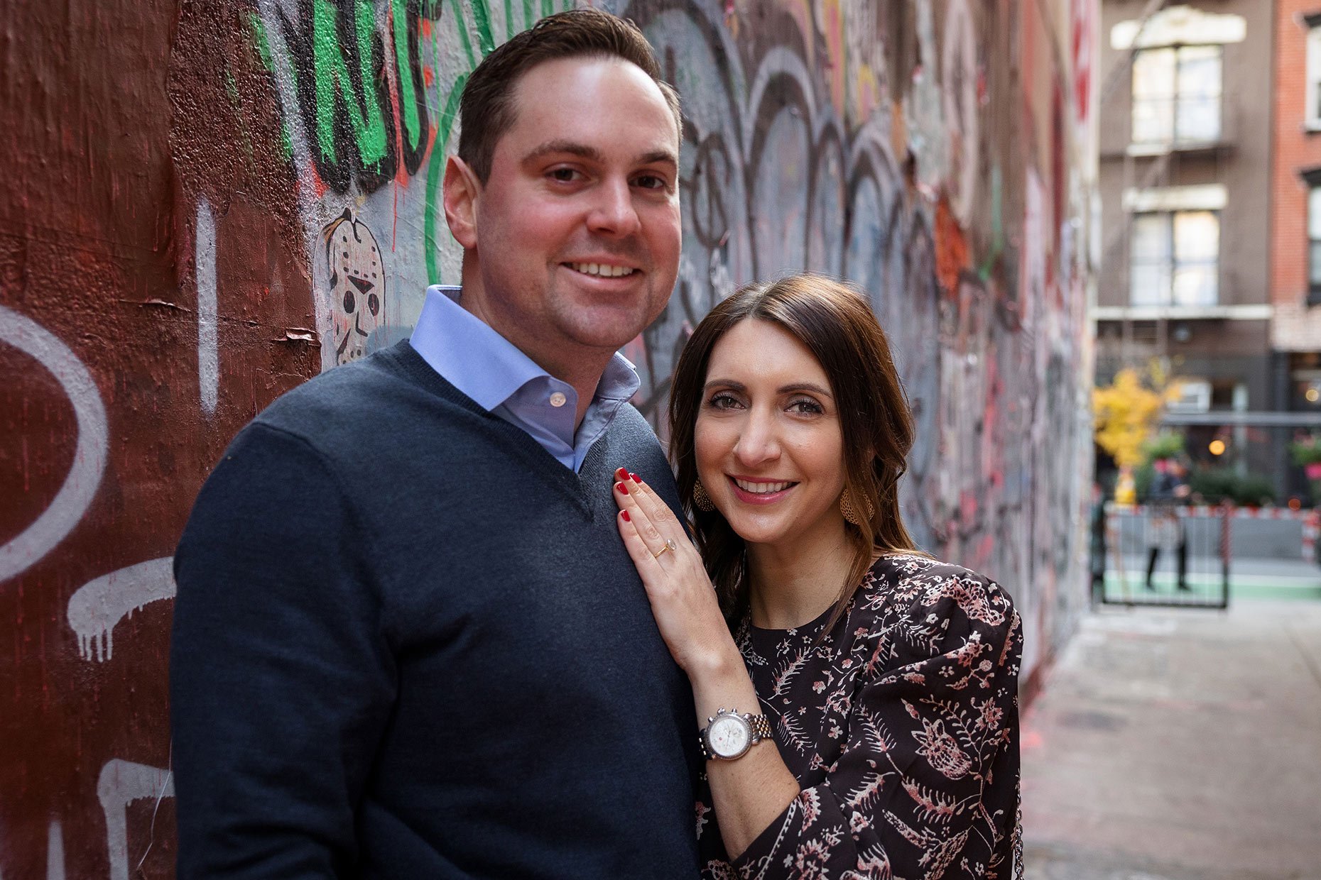 Engagment Photo in front of Graffiti wall at Freeman's Alley