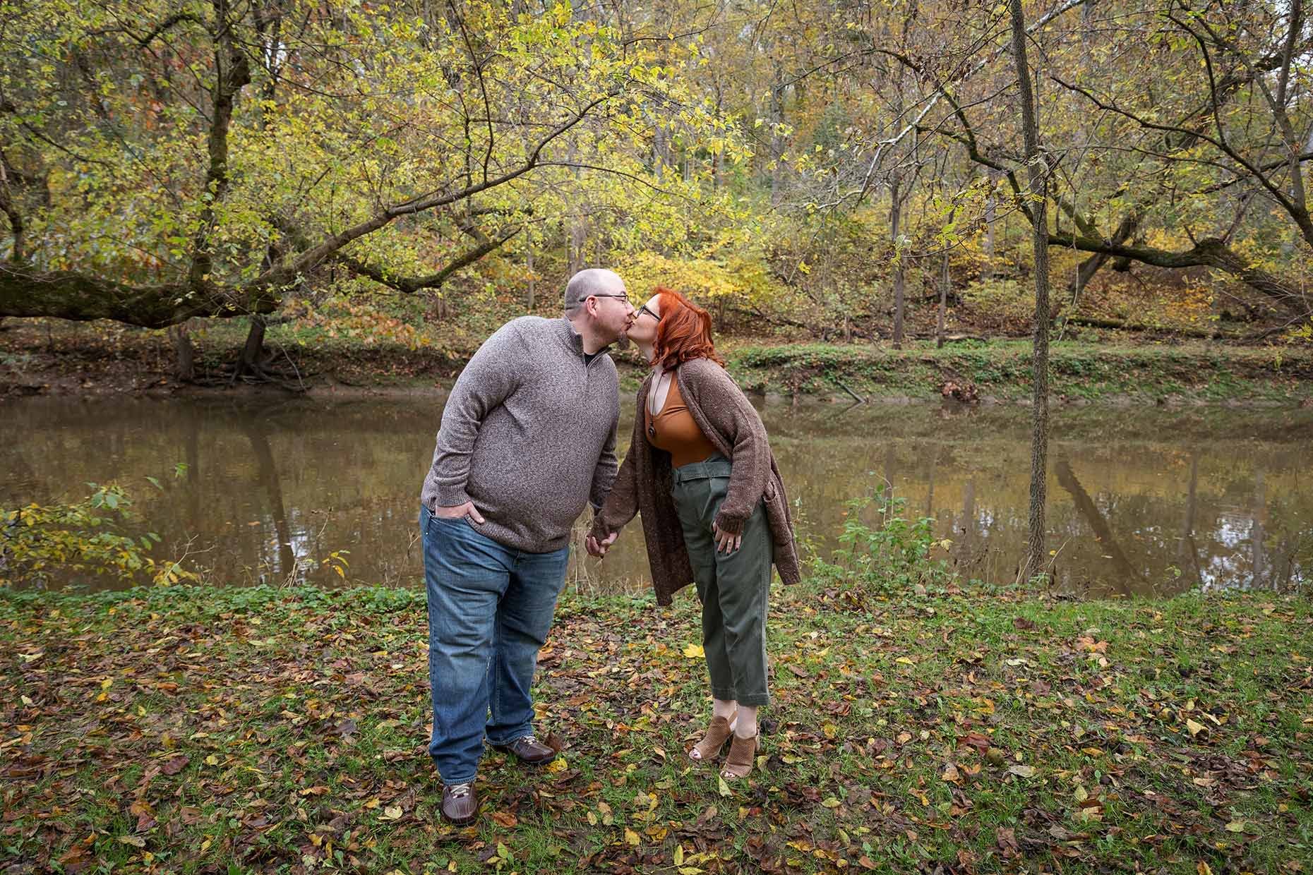 Engagement photos by the river in fall
