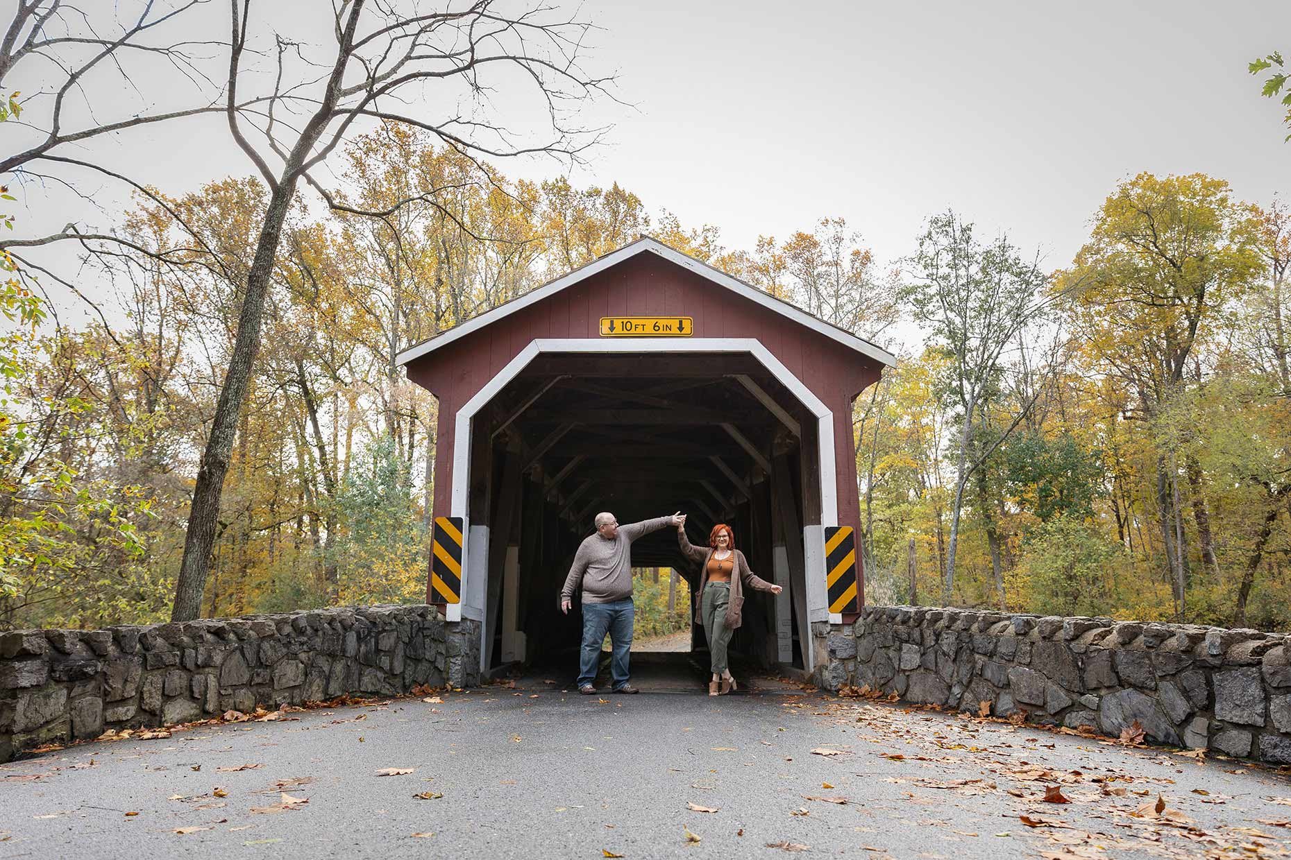 Couple Twirling on Covered Bridge