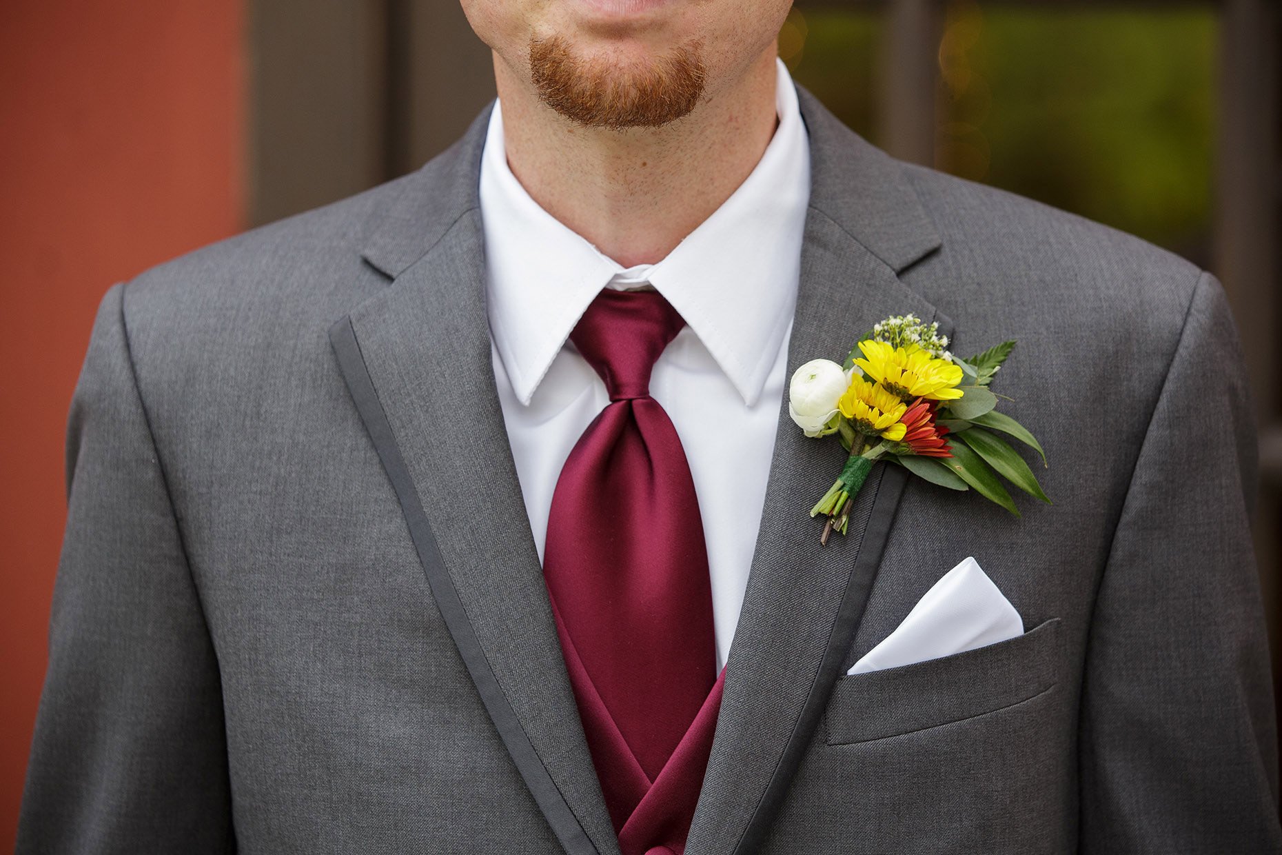 Groom's Boutonniere in gray suit