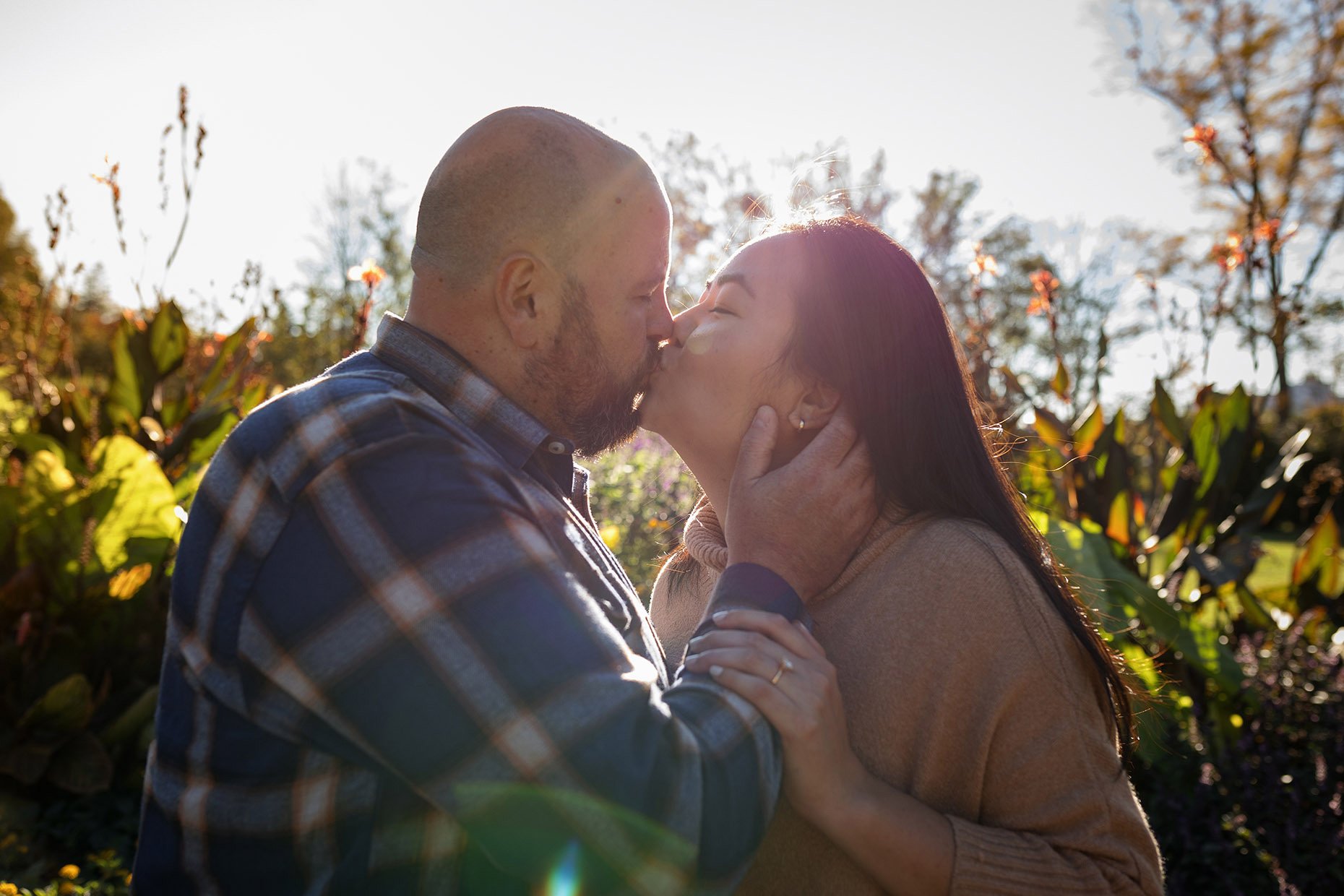 Couple Kissing with Sun Flare