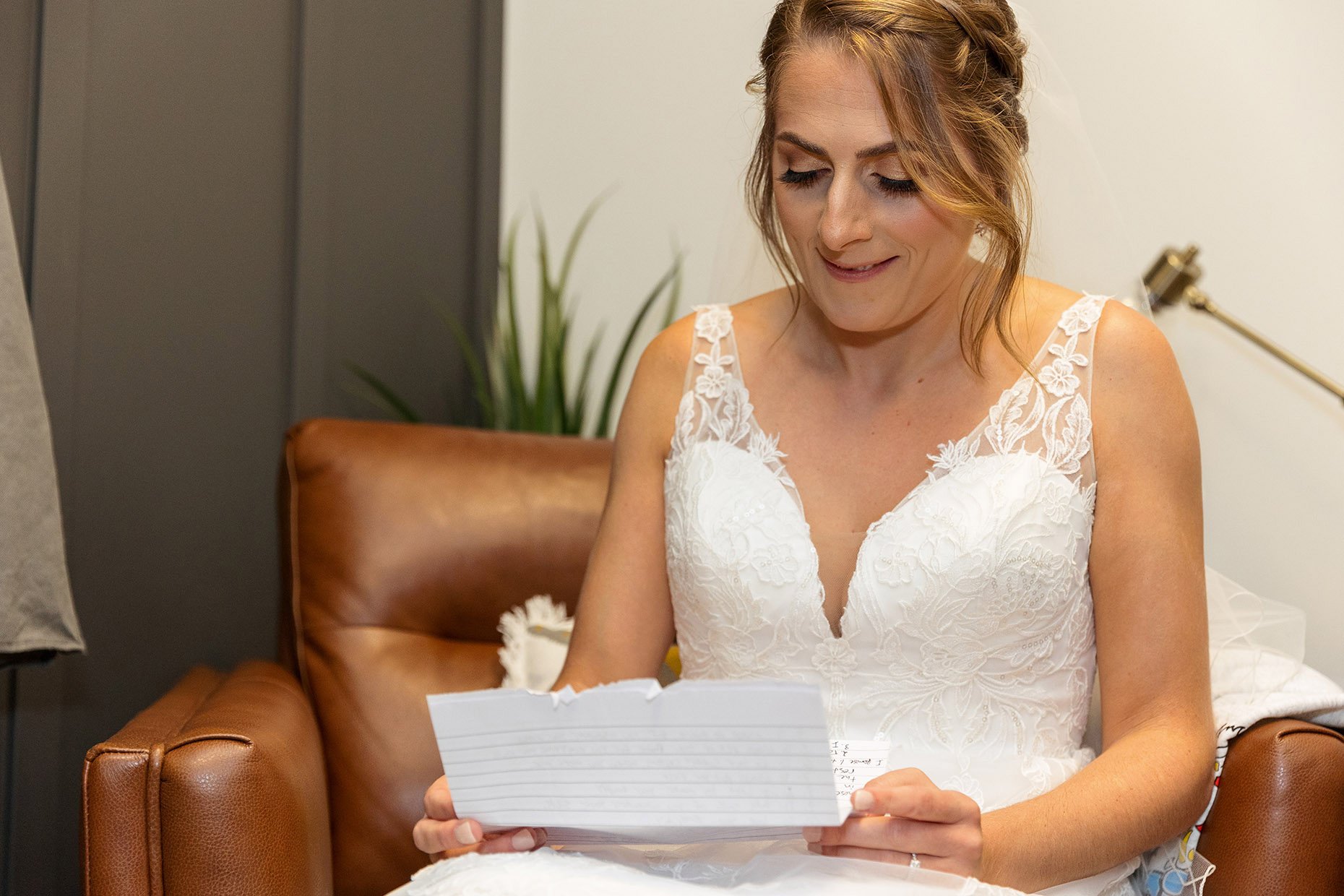 Bride reading a note from her groom