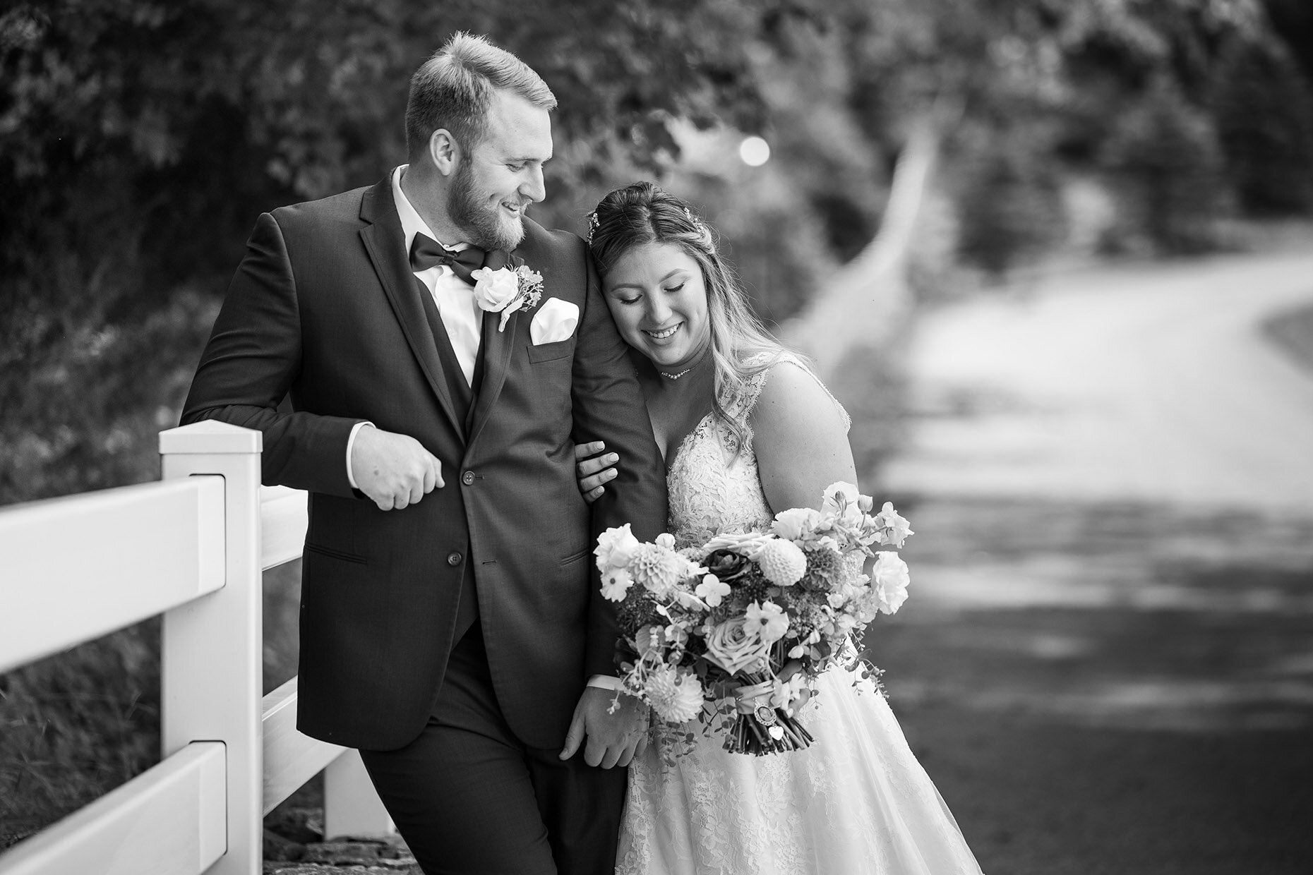 Bride &amp; Groom in black and white snuggling