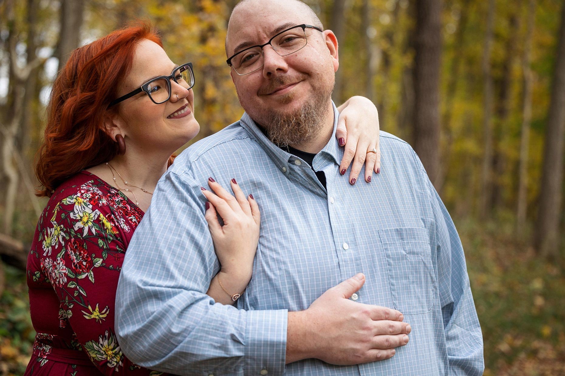 couple snuggling for engagement photos