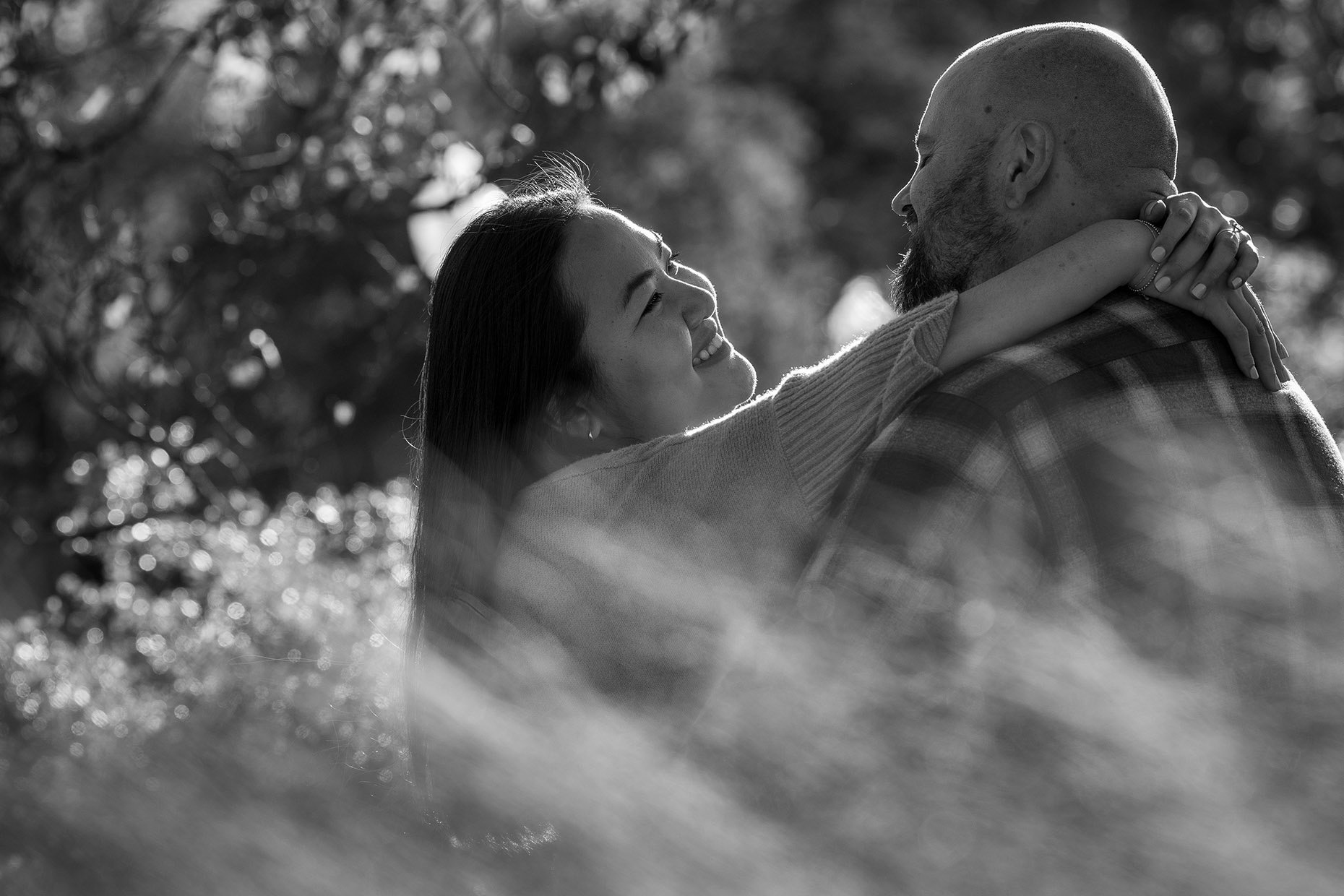 Engagement photos in grass black and white