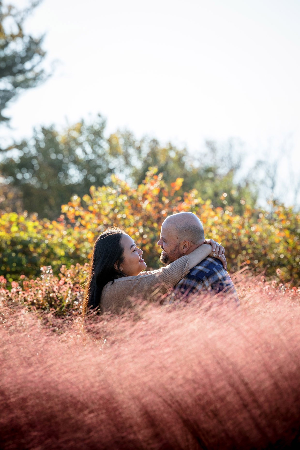Pink Grasses and golden leaves engagement photo