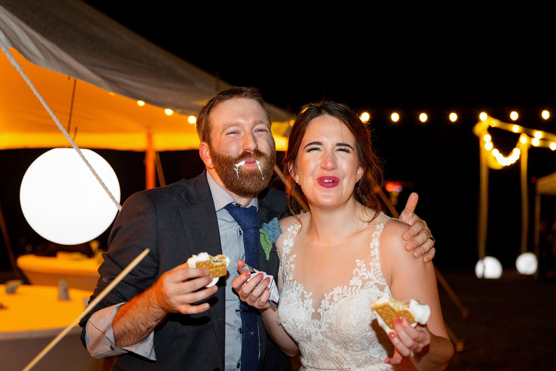 Bride and Groom eating smores at reception 